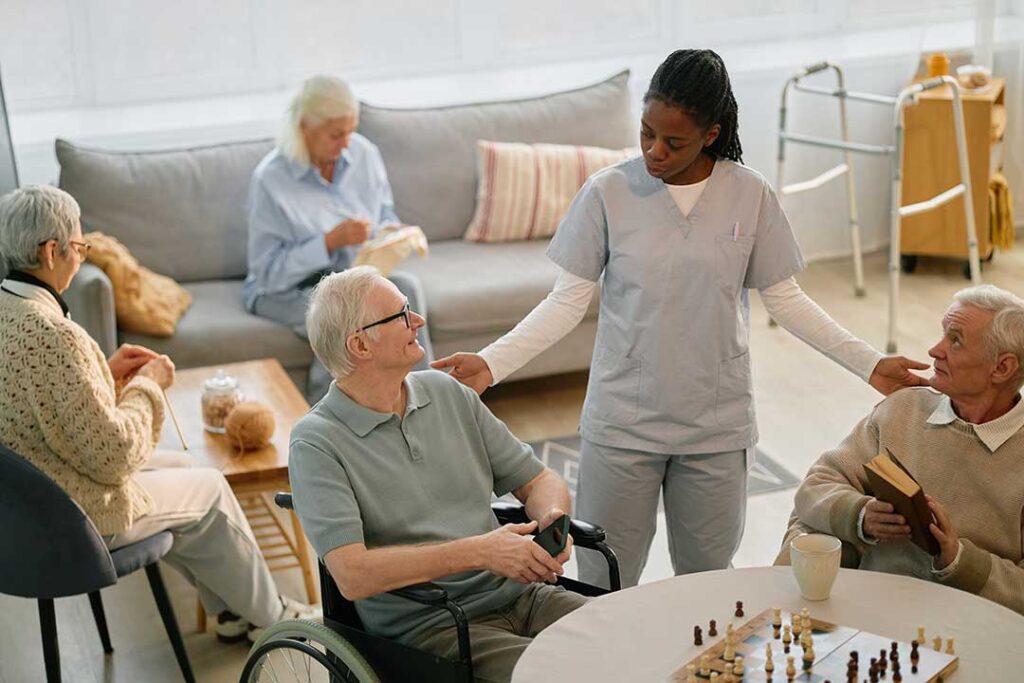 Older adult and family member reviewing care options together in a bright assisted living apartment.
