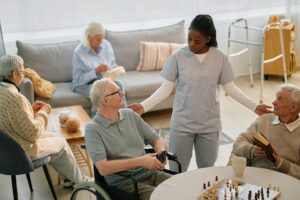 Older adult and family member reviewing care options together in a bright assisted living apartment.